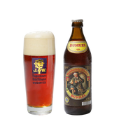 A bottle of Augustiner Dunkel lager next to a glass of the Dunkel larger with a delicious white foam head. 