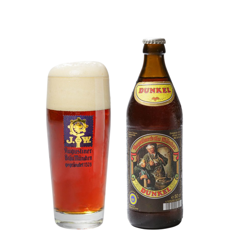 A bottle of Augustiner Dunkel lager next to a glass of the Dunkel larger with a delicious white foam head. 