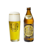 A bottle of Augustiner Edelstoff Lager and a glass showing the golden beer with a crisp white head