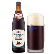 A bottle of Weltenburger Kloster Asam Bock beer next to a filled glass of the dark beer with a thick white foam head, on a white background.