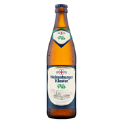 A bottle of Weltenburger Kloster Pils beer, showing the amber glass Pilsner bottle with condensation droplets, a dark blue neck label, and a white and blue main label with a red cross logo.