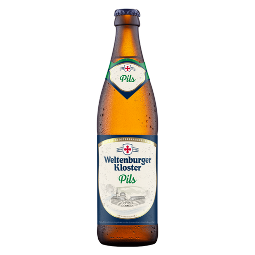 A bottle of Weltenburger Kloster Pils beer, showing the amber glass Pilsner bottle with condensation droplets, a dark blue neck label, and a white and blue main label with a red cross logo.